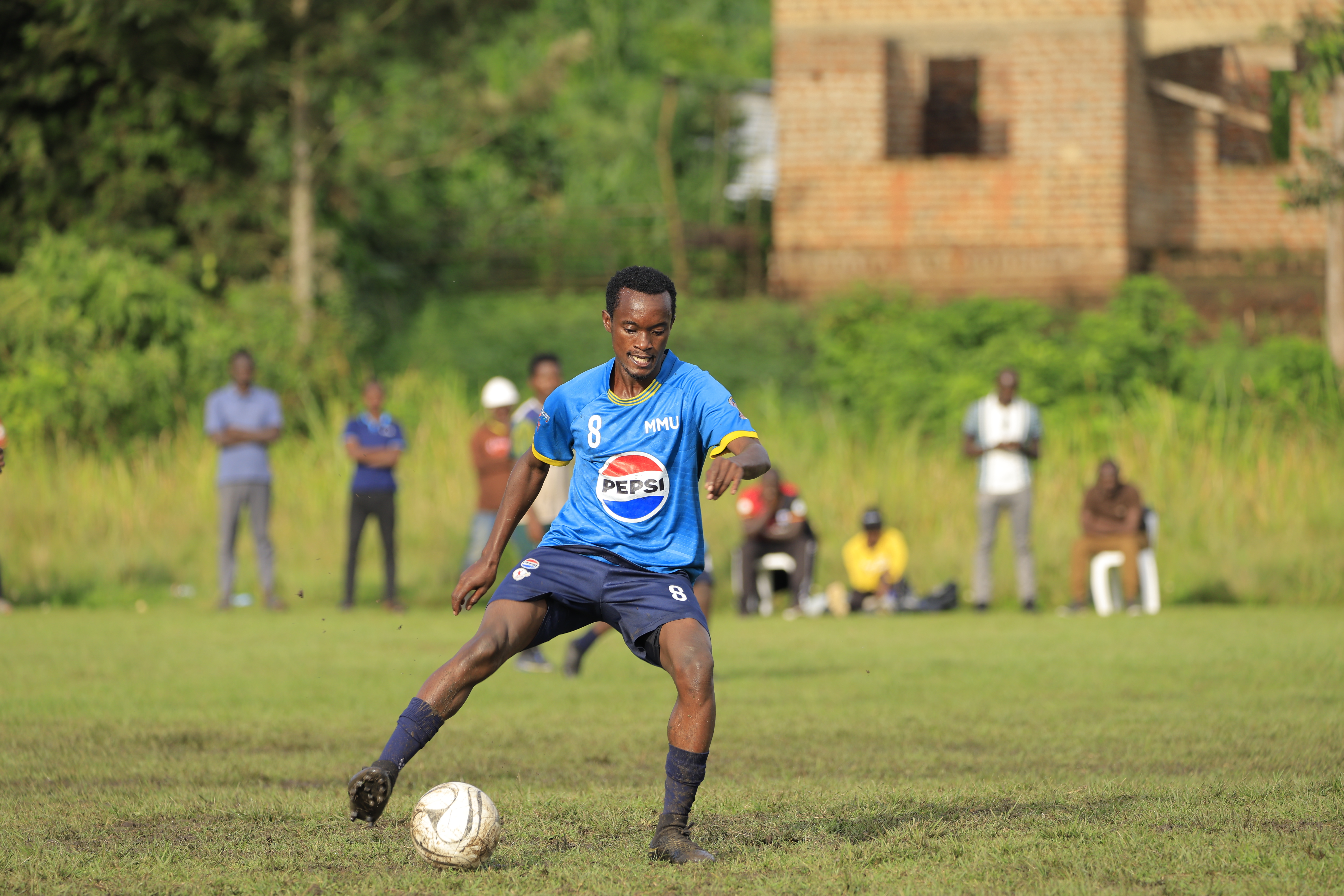 MMU football team in action